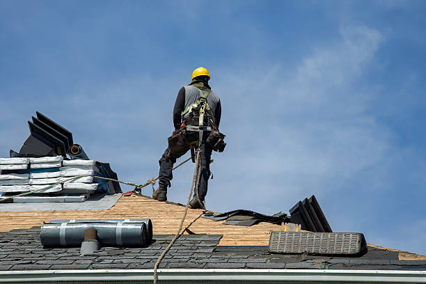Professional Gutter Installation technician working in Arlington Heights, WA